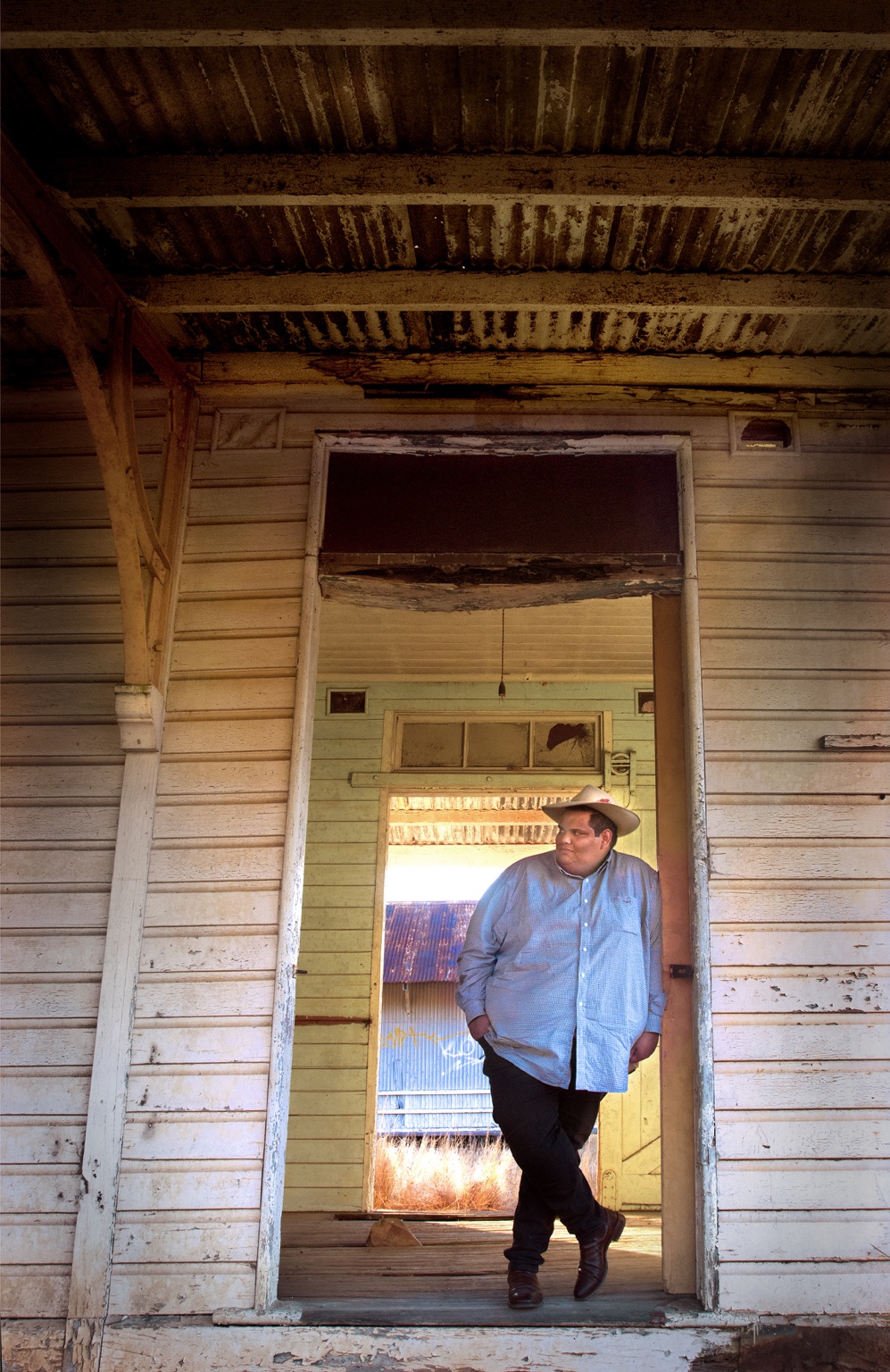 Portrait of Pat Brown Jr in a rustic country setting.
